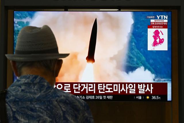 News coverage showing file footage of a North Korean missile launch is seen on a screen at a train station in Seoul on August 6, 2026. North Korea fired a short-range ballistic missile over the Sea of Japan on August 6, Seoul's military said, with the launch coming after Pyongyang lambasted Japan's military build-up in the Pacific. (Photo by GREG BAKER / AFP)