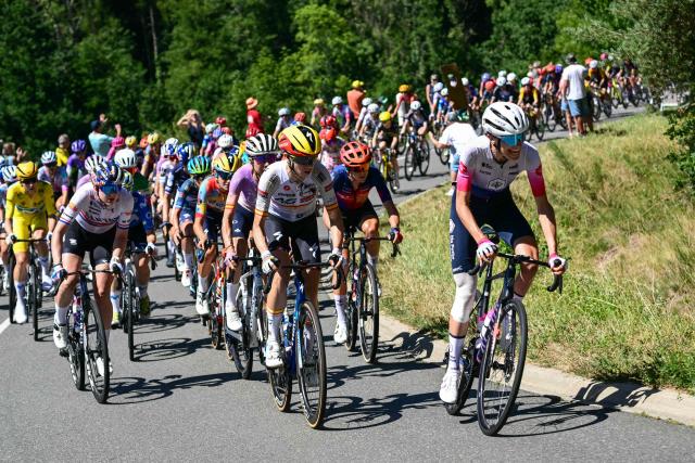 The pack ascends the Cote de Perigneaux during the 6th (out of 9) stage of the fifth edition of the Women's Tour de France cycling race, 153.4 km from Montbrison to Tournon-sur-Rhone, in Perigneaux, central-eastern France on August 6, 2026. (Photo by NICOLAS TUCAT / AFP)