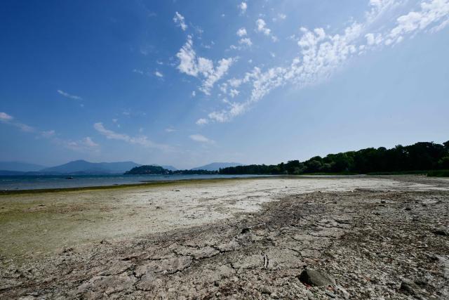 This photograph shows sandbanks exposed by the receding waters of Lake Maggiore, in Ispa, northern Italy, on August 6, 2026. (Photo by Stefano RELLANDINI / AFP)