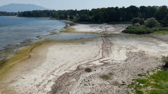 This aerial photograph shows sandbanks exposed by the receding waters of Lake Maggiore, in Ispa, northern Italy, on August 6, 2026. (Photo by Stefano RELLANDINI / AFP)