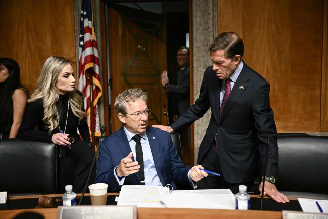 Chairman of the Senate Homeland Security and Governmental Affairs Senator Rand Paul (2L) speaks with Senator Richard Blumenthal (R), Democrat of Connecticut during a Senate Committee on Homeland Security and Governmental Affairs business meeting to consider pending calendar business on Capitol Hill in Washington, DC, on August 6, 2026. The committee is scheduled to vote on whether to hold Dr. Anthony Fauci, who led the US response to the COVID-19 pandemic, in contempt of Congress. (Photo by Brendan SMIALOWSKI / AFP)