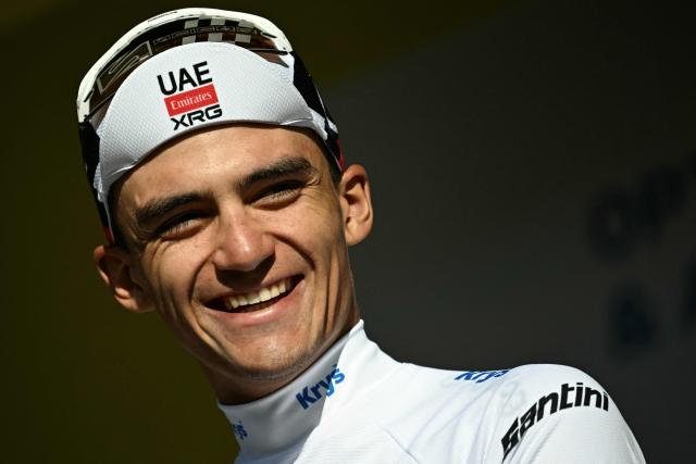 (FILES) UAE Team Emirates - XRG's Mexican rider Isaac Del Toro celebrates on the podium with the best young rider's white jersey after the 18th stage of the 113th edition of the Tour de France cycling race, 185,2 km between Voiron and Orcières-Merlette in the French Alps, on July 23, 2026. Mexican cyclist Isaac Del Toro, who finished third in the last Tour de France at the age of just 22, has extended his contract with UAE until 2031, the UAE-based team announced on August 6, 2026. (Photo by Loic VENANCE / AFP)