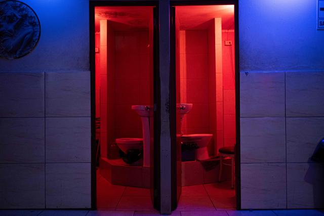 View inside La Miel brothel during an anti-human trafficking police operation called Sodom and Gomorrah, in the Independencia district, on the northern outskirts of Lima on July 31, 2026 late night. (Photo by ERNESTO BENAVIDES / AFP)