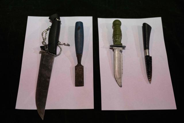 View of knives seized at La Miel brothel during an anti-human trafficking police operation called Sodom and Gomorrah, in the Independencia district, on the northern outskirts of Lima on August 1, 2026. (Photo by ERNESTO BENAVIDES / AFP)
