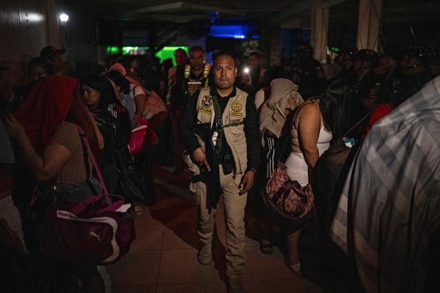Members of the Peruvian National Police conduct an anti-human trafficking operation called Sodom and Gomorrah at La Miel brothel, in the Independencia district, on the northern outskirts of Lima on July 31, 2026 late night. (Photo by ERNESTO BENAVIDES / AFP)