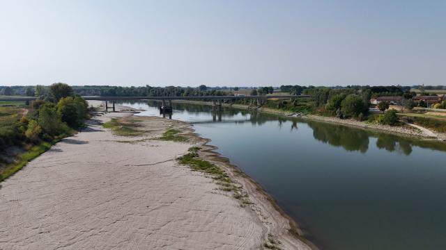 This aerial photograph shows sandbanks exposed by the receding waters of the Po River in Isola Pescaroli, northern Italy, on August 6, 2026. (Photo by Stefano RELLANDINI / AFP)