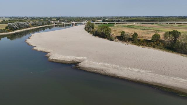 This aerial photograph shows sandbanks exposed by the receding waters of the Po River in Isola Pescaroli, northern Italy, on August 6, 2026. (Photo by Stefano RELLANDINI / AFP)