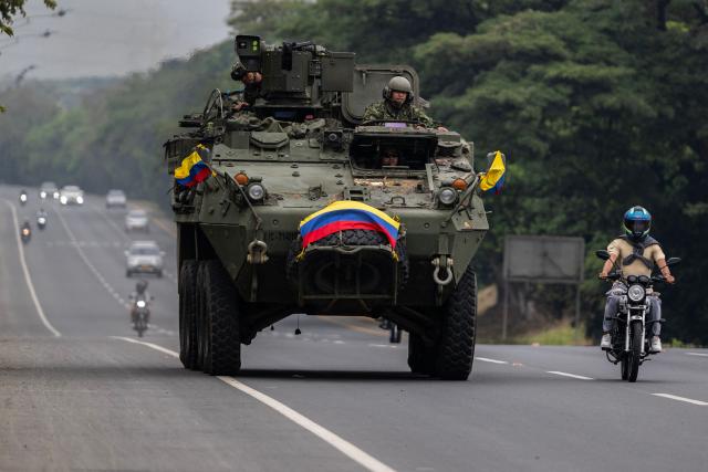 A Colombian Army armored vehicle patrols along a highway near Alfonso Bonilla Aragón International Airport on the eve of the inauguration of Colombian president-elect Abelardo de la Espriella in Cali, Colombia, on August 6, 2026. (Photo by Luis ACOSTA / AFP)