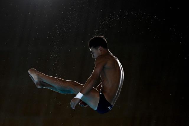 Italy's diver Romano Hao Jun Wang competes in the men's 10m platform diving final event during the LEN European Aquatics Championships, at the Olympic Aquatics Centre in Saint-Denis, northeastern suburbs of Paris on August 6, 2026. (Photo by JULIEN DE ROSA / AFP)