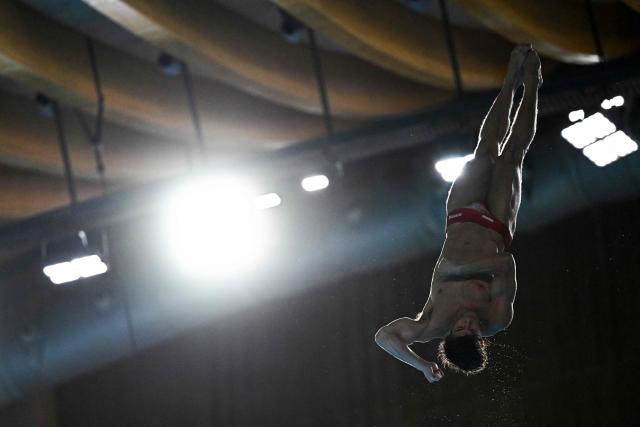 Austria's diver Dariush Lotfi competes in the men's 10m platform diving final event during the LEN European Aquatics Championships, at the Olympic Aquatics Centre in Saint-Denis, northeastern suburbs of Paris on August 6, 2026. (Photo by JULIEN DE ROSA / AFP)