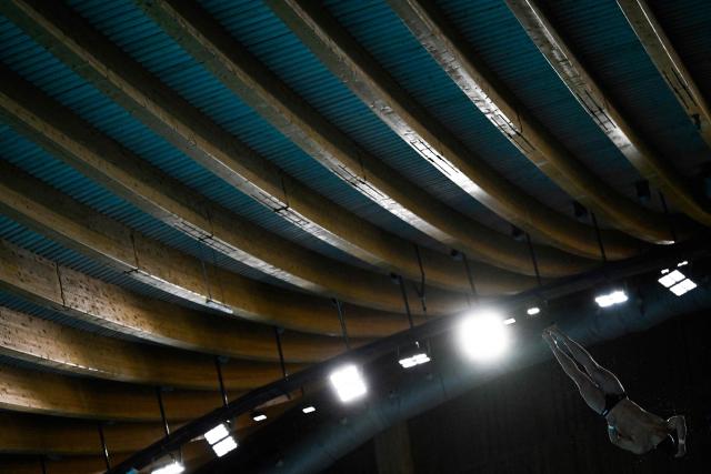 Austria's diver Anton Knoll competes in the men's 10m platform diving final event during the LEN European Aquatics Championships, at the Olympic Aquatics Centre in Saint-Denis, northeastern suburbs of Paris on August 6, 2026. (Photo by JULIEN DE ROSA / AFP)