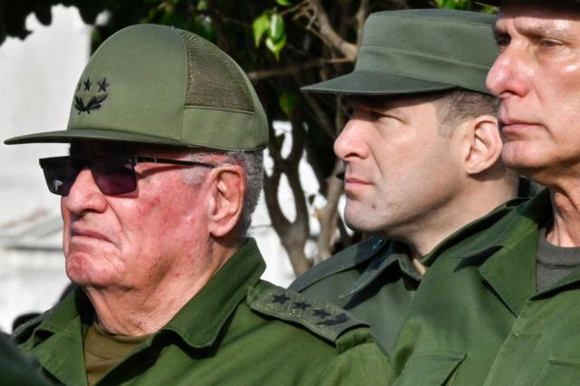 (FILES) Cuba's President Miguel Diaz-Canel (R), Colonel Raul Guillermo Rodriguez Castro (C), grandson of former President Raul Castro, and Armed Forces Minister General Alvaro Lopez Miera attend the funeral of the 32 Cuban soldiers killed during the US incursion in Venezuela at Colon cemetery in Havana on January 16, 2026. The United States announced new sanctions on August 6, 2026, that target Cuban Armed Forces Minister General Alvaro Lopez Miera, seven other individuals and five state-owned entities over their alleged role in foreign military cooperation and arms procurement. (Photo by ADALBERTO ROQUE / AFP)