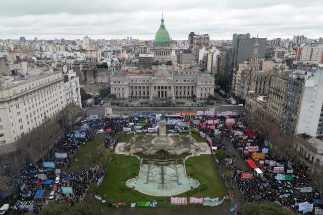 Aerial view showing demonstrators protesting outside the National Congress in Buenos Aires on August 6, 2026, as senators debate the bill on the inviolability of private property. (Photo by Luis ROBAYO / AFP)