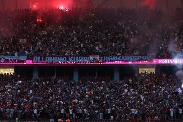 Trabzonspor's supporters cheer their newly recruited player Egyptian forward Mohamed Salah during his signing cerenomy at the Papara Park Stadium in Trabzon on August 6, 2026. Former Liverpool star Mohamed Salah on August 6, 2026 signed a two-year contract with Turkish club Trabzonspor after leaving the Premier League giants at the end of his contract. (Photo by Nurgul GUNAYDIN / AFP)