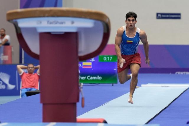 Colombia's Camilo Keynher competes in the men's vault final during the XXV Central American and Caribbean Games in Santo Domingo on August 6, 2026. (Photo by Francesco SPOTORNO / AFP)
