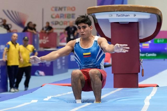 Colombia's Camilo Keynher competes in the men's vault final during the XXV Central American and Caribbean Games in Santo Domingo on August 6, 2026. (Photo by Francesco SPOTORNO / AFP)