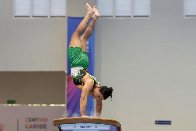 Jamaica's Clayton Bell competes in the men's vault final during the XXV Central American and Caribbean Games in Santo Domingo on August 6, 2026. (Photo by Francesco SPOTORNO / AFP)