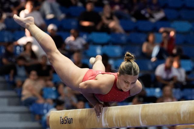 Costa Rica's Samantha Marin competes in the women's balance beam final during the XXV Central American and Caribbean Games in Santo Domingo on August 6, 2026. (Photo by Francesco SPOTORNO / AFP)