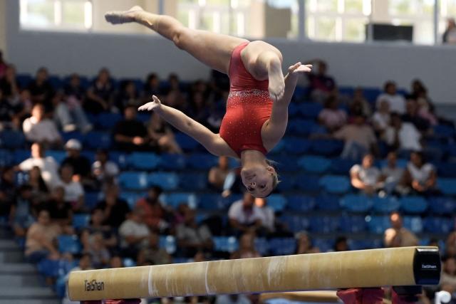 Costa Rica's Samantha Marin competes in the women's balance beam final during the XXV Central American and Caribbean Games in Santo Domingo on August 6, 2026. (Photo by Francesco SPOTORNO / AFP)