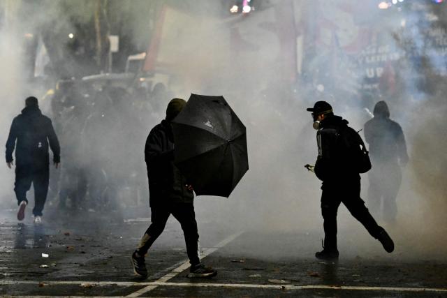 Police disperse the demonstrators with tear gas during a protest near the National Congress in Buenos Aires on August 6, 2026, as senators debate a bill on the inviolability of private property. (Photo by Luis ROBAYO / AFP)