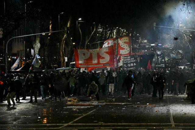 Demonstrators protest near to the National Congress in Buenos Aires on August 6, 2026, as senators debate a bill on the inviolability of private property. (Photo by Luis ROBAYO / AFP)