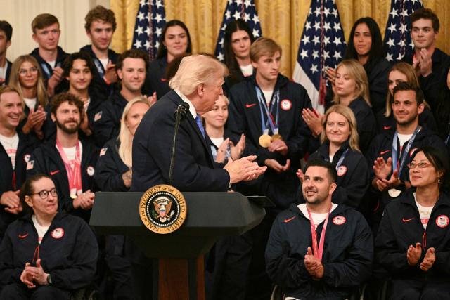 US President Donald Trump applauds Team USA Olympic and Paralympic winter athletes during an event in the East Room of the White House in Washington, DC, on August 6, 2026. (Photo by Jim WATSON / AFP)