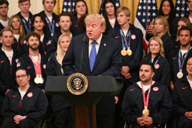 US President Donald Trump speaks during an event welcoming Team USA Olympic and Paralympic winter athletes in the East Room of the White House in Washington, DC, on August 6, 2026. (Photo by Jim WATSON / AFP)