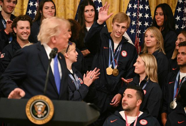 Gold medalist speed skater Jordan Stolz waves after being mentioned by US President Donald Trump during an event welcoming Team USA Olympic and Paralympic winter athletes in the East Room of the White House in Washington, DC, on August 6, 2026. (Photo by Jim WATSON / AFP)