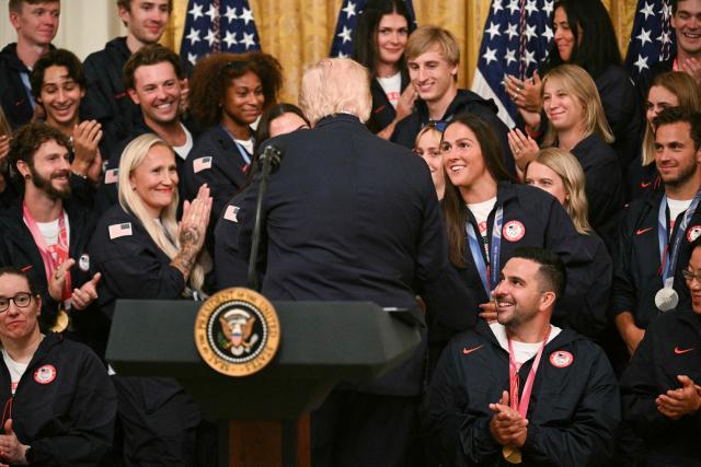 US President Donald Trump shakes hands with Team USA Olympic and Paralympic winter athletes during an event in the East Room of the White House in Washington, DC, on August 6, 2026. (Photo by Jim WATSON / AFP)