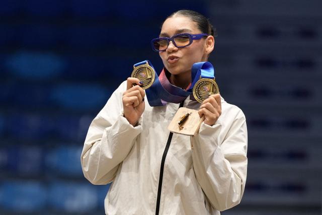 Panama's Alyiah Lide poses on the podium after winning the gold medals in the women's balance beam and floor exercise gymnastics finals during the XXV Central American and Caribbean Games in Santo Domingo on August 6, 2026. (Photo by Francesco SPOTORNO / AFP)