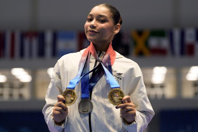 Panama's Alyiah Lide poses with her medals during the XXV Central American and Caribbean Games in Santo Domingo on August 6, 2026. (Photo by Francesco SPOTORNO / AFP)
