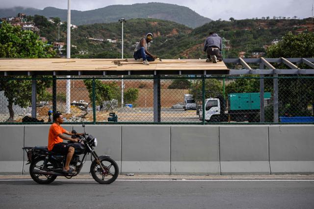 Workers carry out construction work on the structure of a new passenger area at Simon Bolivar International Airport in La Guaira, Venezuela, on August 6, 2026. (Photo by Maxwell BRICENO / AFP)