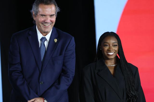 President of the Pan American Sports Organization Neven Ilic and US gymnast Simone Biles attend the official countdown celebrations marking one year until the 2027 Pan American Games in Lima on August 6, 2026. (Photo by Connie FRANCE / AFP)