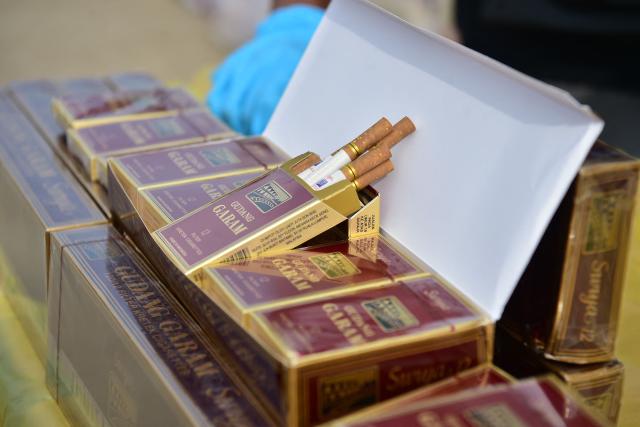 Confiscated cigarette cartons are pictured following an operation to seize the smuggled items worth over 20 million THB (600,000 USD) at the Narathiwat Provincial Police Station in the southern Thai province of Narathiwat on August 7, 2026. (Photo by Madaree TOHLALA / AFP)