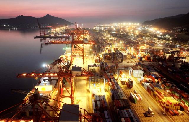 Shipping containers are seen at the cargo port in Lianyungang, eastern China's Jiangsu province on August 7, 2026. (Photo by CN-STR / AFP) / China OUT