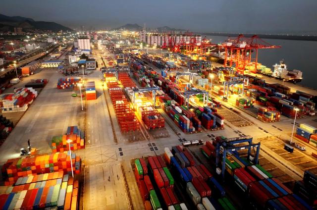 Shipping containers are seen at the cargo port in Lianyungang, eastern China's Jiangsu province on August 7, 2026. (Photo by CN-STR / AFP) / China OUT