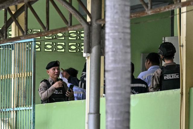 Police and emergency responders are pictured on the school premises following a shooting in Bang Kruai district, Nonthaburi province, north of Thailand's capital Bangkok, on August 7, 2026. At least four people were killed and 15 students injured during a school shooting just north of the Thai capital Bangkok on August 7, the deputy interior minister said. (Photo by Lillian SUWANRUMPHA / AFP)