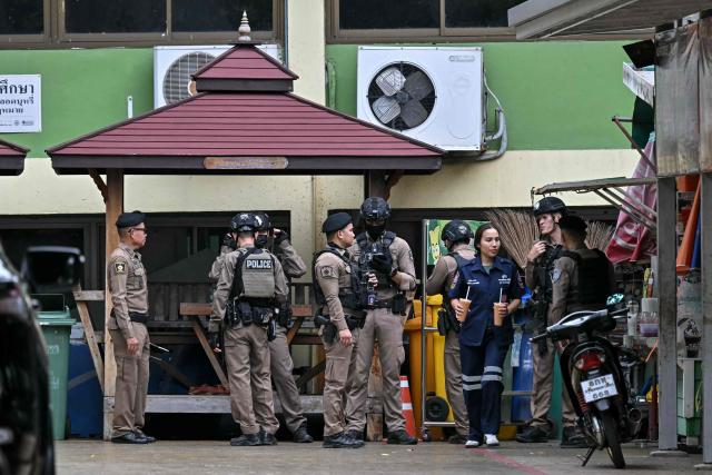 Thai police gather following a school shooting in Bang Kruai district, Nonthaburi province, north of Thailand's capital Bangkok, on August 7, 2026. At least four people were killed and 15 students injured during a school shooting just north of the Thai capital Bangkok on August 7, the deputy interior minister said. (Photo by Lillian SUWANRUMPHA / AFP)