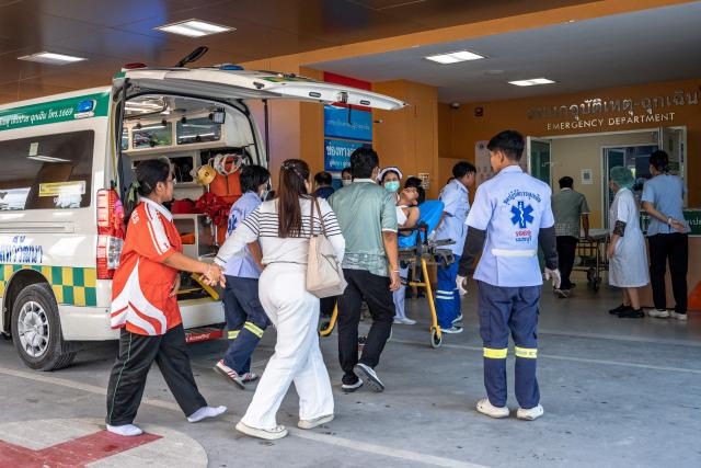 A school shooting victim is transported on a stretcher into Bang Yai hospital in Nonthaburi province, north of Thailand's capital Bangkok, on August 7, 2026. At least four people were killed and 15 students injured during a school shooting just north of the Thai capital Bangkok on August 7, the deputy interior minister said. (Photo by Chanakarn LAOSARAKHAM / AFP)