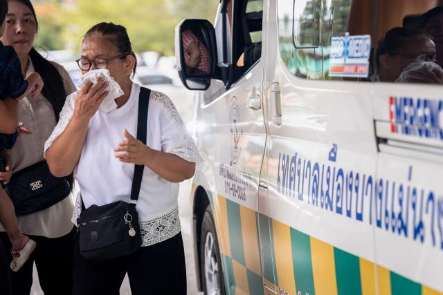 A woman reacts following a school shooting as victims arrive at Bang Yai hospital in Nonthaburi province, north of Thailand's capital Bangkok, on August 7, 2026. At least four people were killed and 15 students injured during a school shooting just north of the Thai capital Bangkok on August 7, the deputy interior minister said. (Photo by Chanakarn LAOSARAKHAM / AFP)
