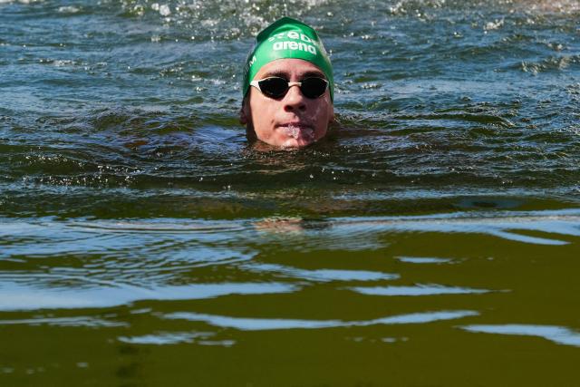 Hungary's swimmer David Betlehem arrives to win the men's 3km knockout open water swimming event during the LEN European Aquatics Championships, at the Seine River in Paris on August 7, 2026. (Photo by Dimitar DILKOFF / AFP)