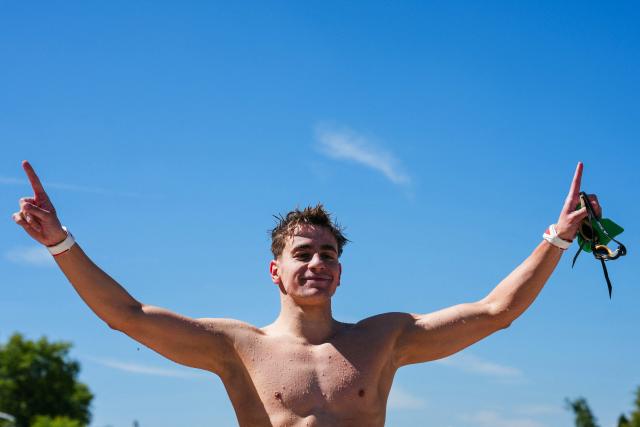 Hungary's swimmer David Betlehem celebrates after winning the men's 3km knockout open water swimming event during the LEN European Aquatics Championships, at the Seine River in Paris on August 7, 2026. (Photo by Dimitar DILKOFF / AFP)