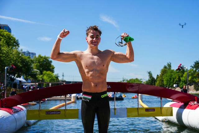 Hungary's swimmer David Betlehem celebrates after winning the men's 3km knockout open water swimming event during the LEN European Aquatics Championships, at the Seine River in Paris on August 7, 2026. (Photo by Dimitar DILKOFF / AFP)