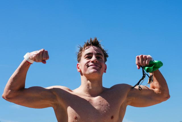 Hungary's swimmer David Betlehem celebrates after winning the men's 3km knockout open water swimming event during the LEN European Aquatics Championships, at the Seine River in Paris on August 7, 2026. (Photo by Dimitar DILKOFF / AFP)