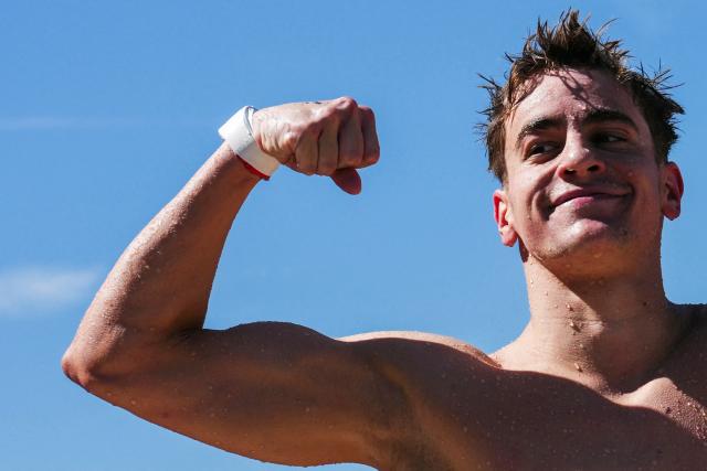 Hungary's swimmer David Betlehem celebrates after winning the men's 3km knockout open water swimming event during the LEN European Aquatics Championships, at the Seine River in Paris on August 7, 2026. (Photo by Dimitar DILKOFF / AFP)