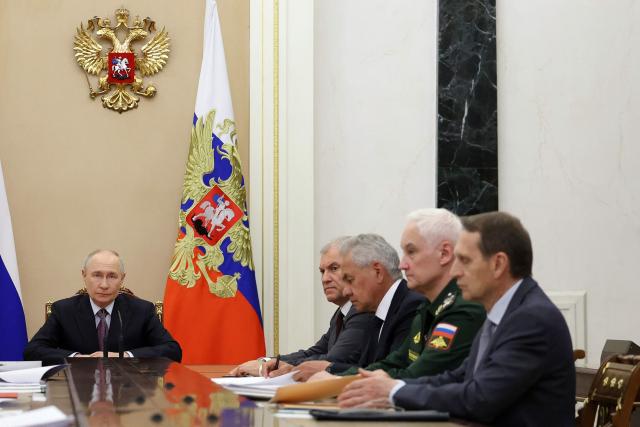 In this pool photograph distributed by the Russian state agency Sputnik, Russia's President Vladimir Putin chairs a Security Council meeting in Moscow on August 7, 2026. (Photo by Alexander KAZAKOV / POOL / AFP)