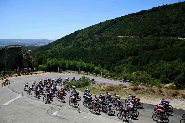The pack of riders (peloton) rides during the 7th (out of 9) stage of the fifth edition of the Women's Tour de France cycling race, 146.8 km from Voulte-sur-Rhone to The Mont Ventoux, at The Mont Ventoux, southeastern France on August 7, 2026. (Photo by NICOLAS TUCAT / AFP)