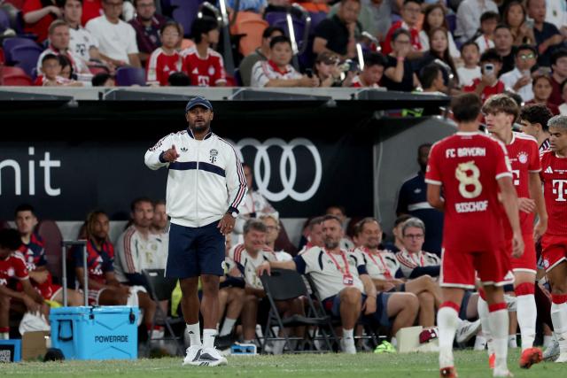 Bayern Munich manager Vincent Kompany (L) reacts during their football match against Aston Villa at Kai Tak Stadium in Hong Kong on August 7, 2026. (Photo by May JAMES / AFP)