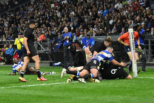 New Zealand's flanker Simon Parker dives across the line to score a try during a rugby union tour match between the Stormers and New Zealand at the Cape Town Stadium in Cape Town on August 7, 2026. (Photo by RODGER BOSCH / AFP)