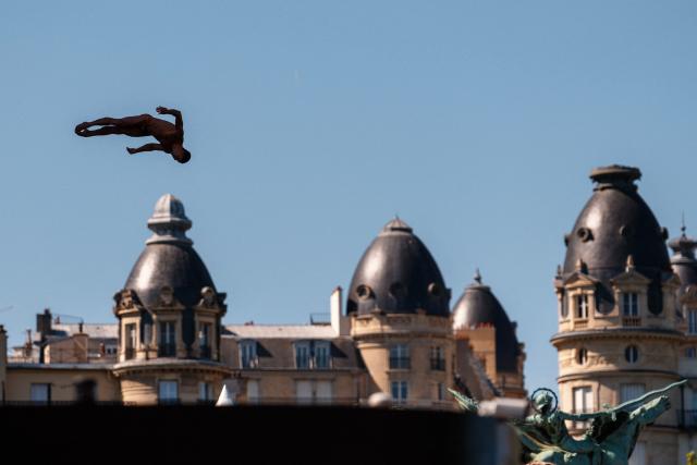 Romania's Constantin Popovici competes in the men’s 20m high diving event during the LEN European Aquatics Championships, alongside the Seine River, in Paris on August 7, 2026. (Photo by Dimitar DILKOFF / AFP)